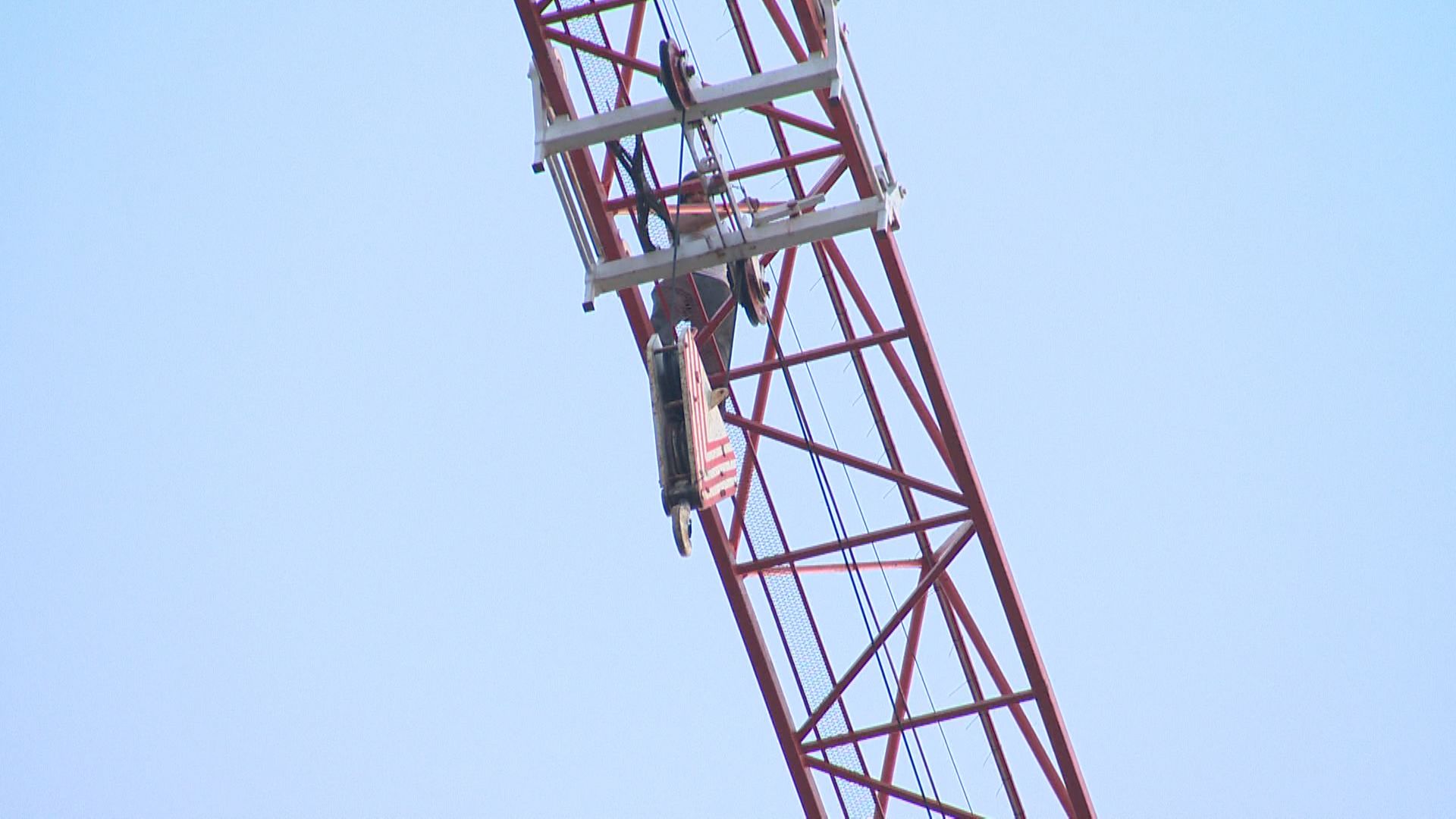 Man climbs construction crane in downtown Kelowna