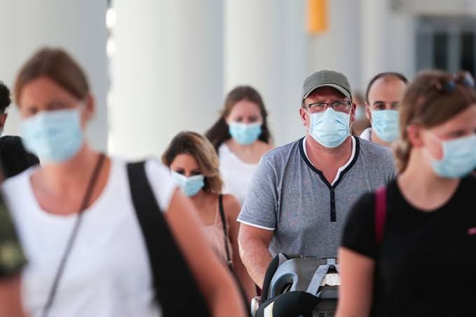 People are masking and taking the risks to travel again
