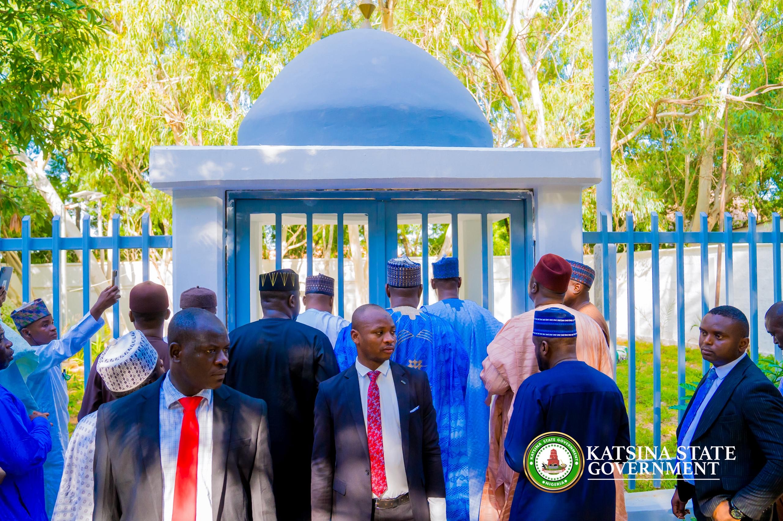 Governor Dikko Radda (centre backing the camera) at the grave site of former President Buhari