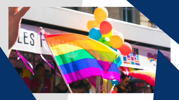 a rainbow flag and balloons