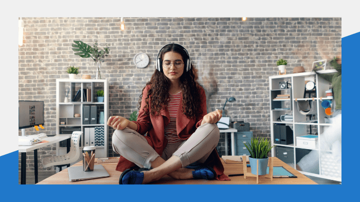 Woman meditating on a desk