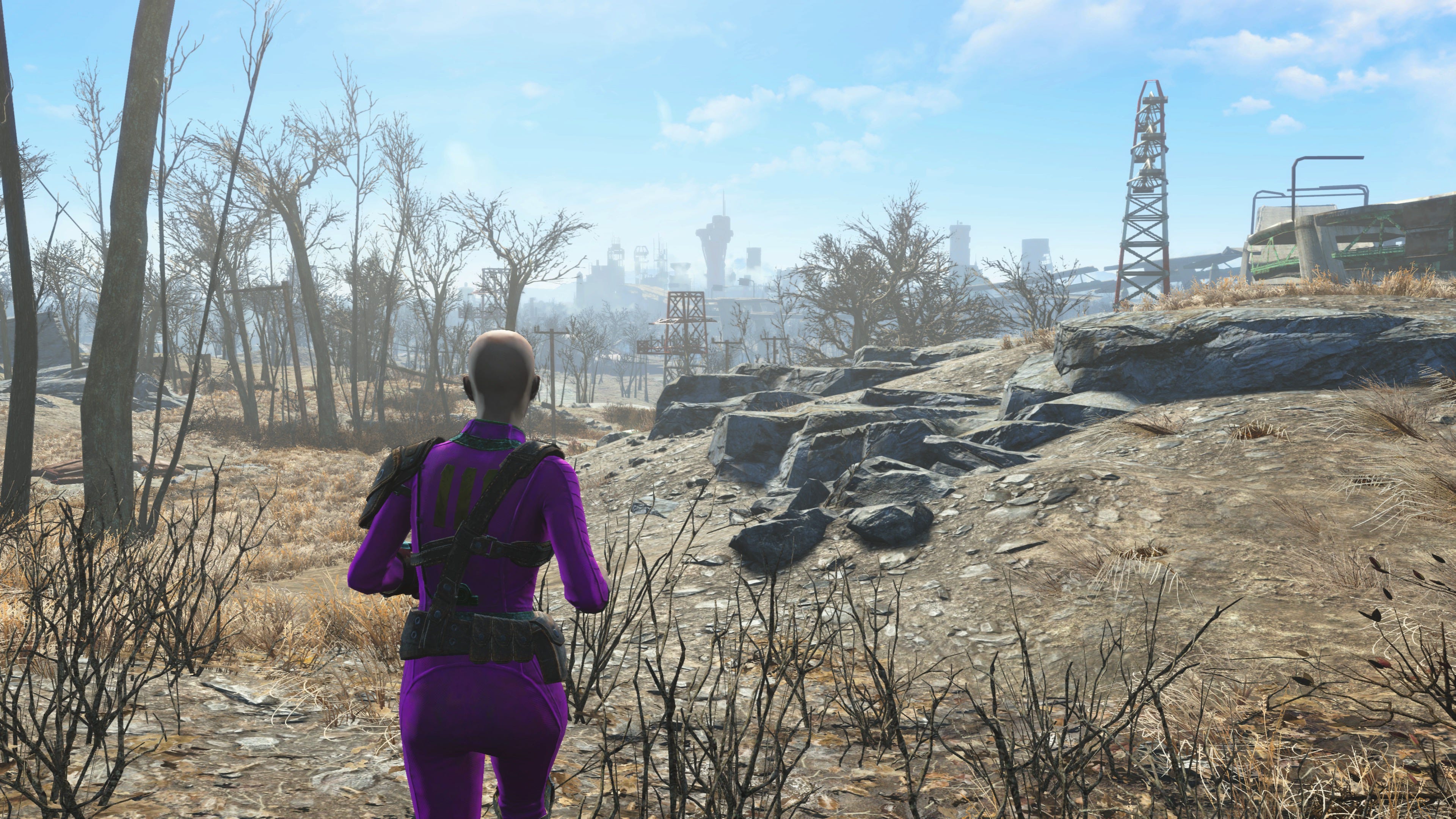 Susan’s Fallout 4 character running in a barren wasteland.