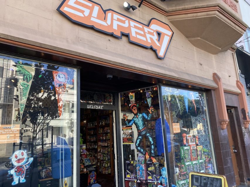 The front of a store with a sign that says super 7.