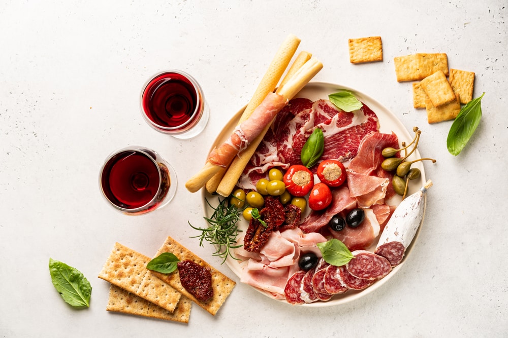 How long can you leave a meat and cheese tray out?