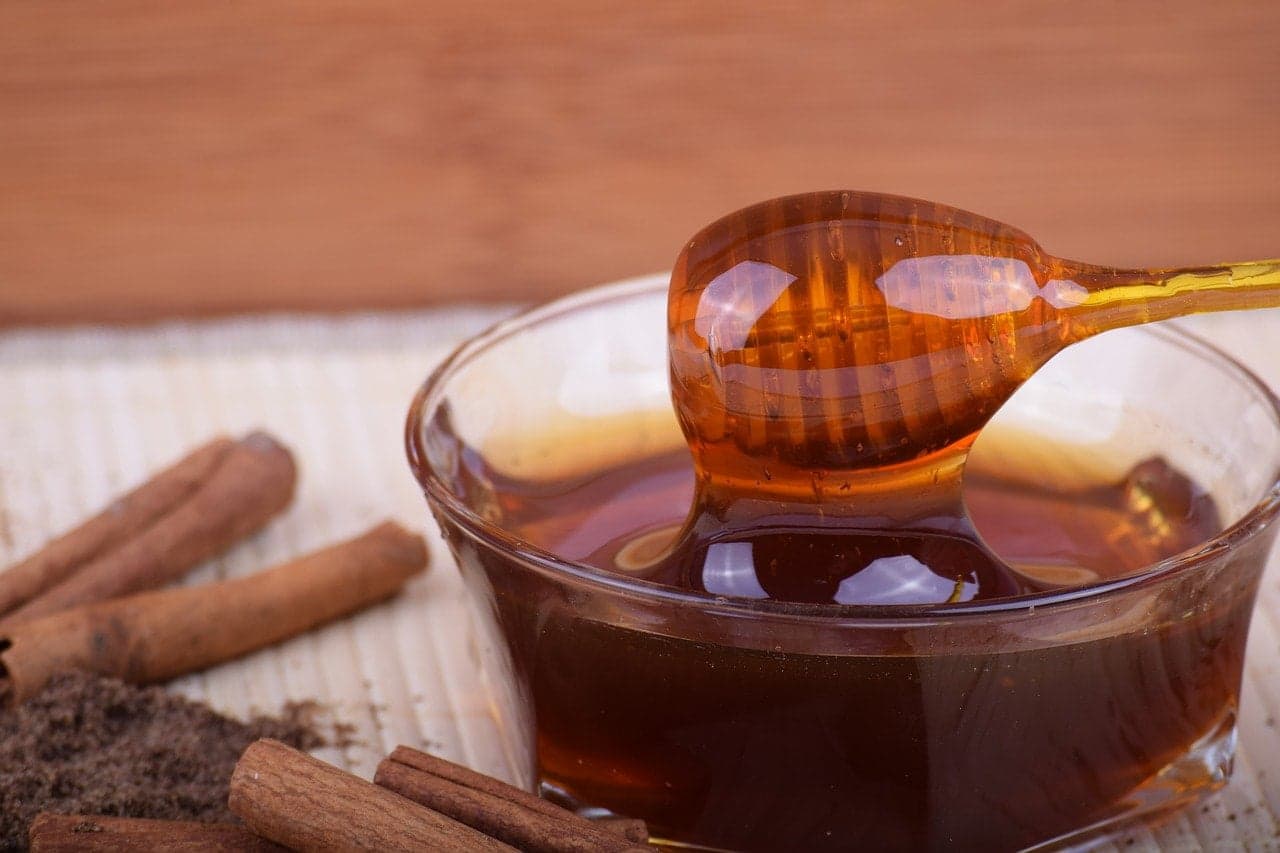 Honey in a bowl with cinnamon