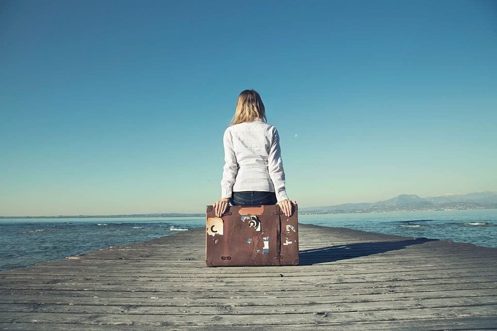 Emotional baggage definition-picture depicting a girl with emotional baggage