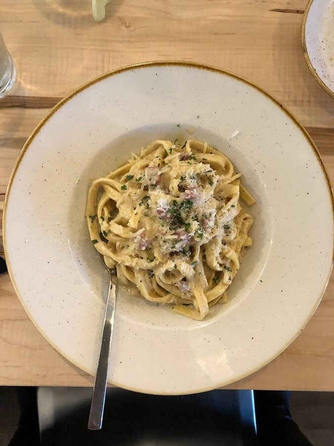 White plate with cooked quinoa noddles-cook quinoa like pasta