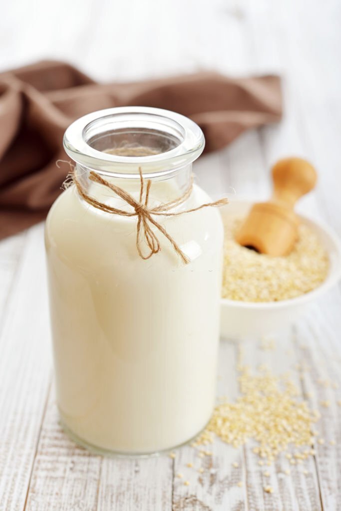 Unlocking the power of quinoa milk: 5 incredible benefits 23 Quinoa milk benefits-bottle of quinoa milk on a table with a bowel of quinoa