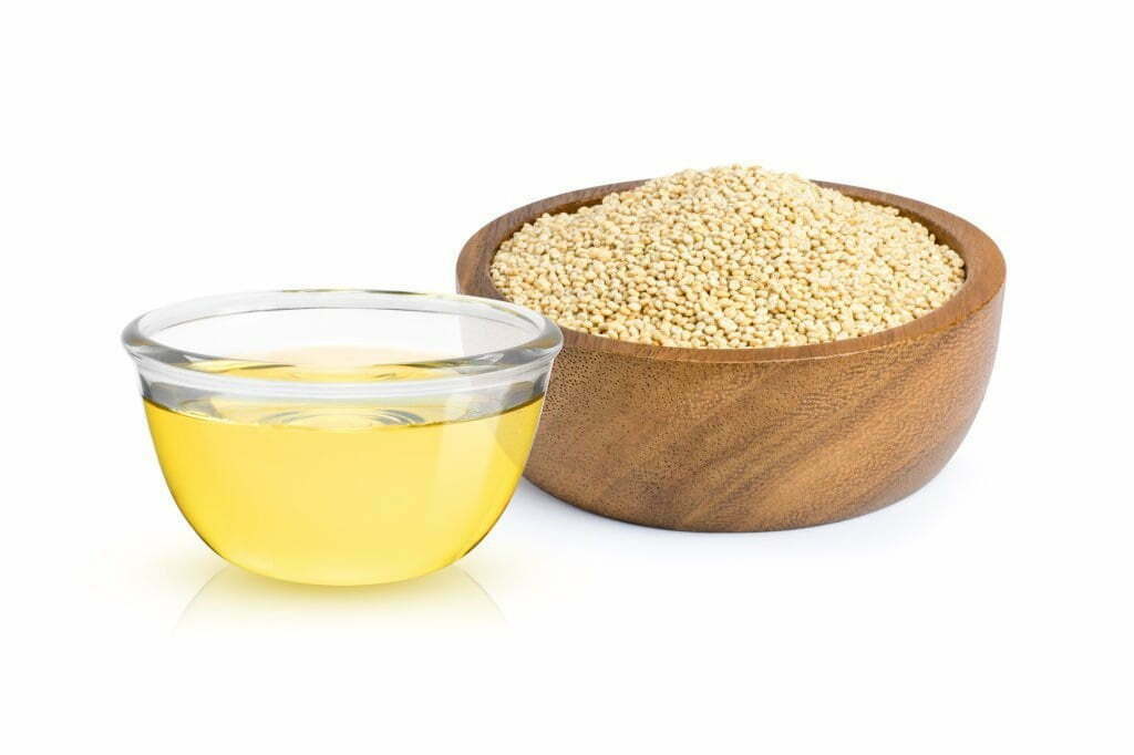 Quinoa and quinoa oil in different bowls
