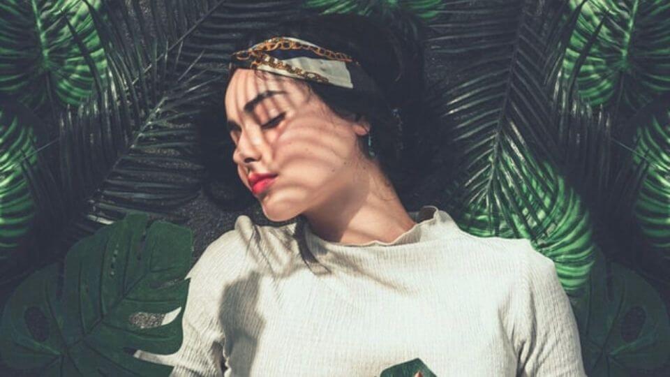 With great power comes great need to take a nap-girl sleeping outdoors among tree leaves