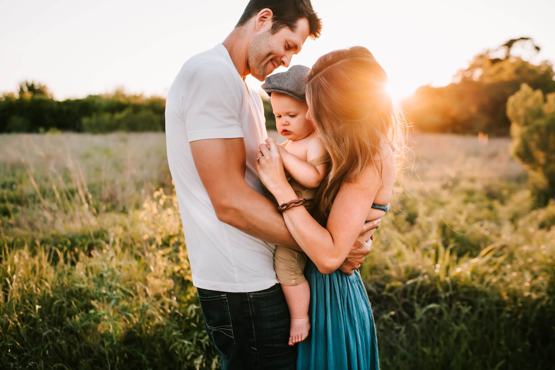 Family photo on green grass during golden hour-what is french parenting