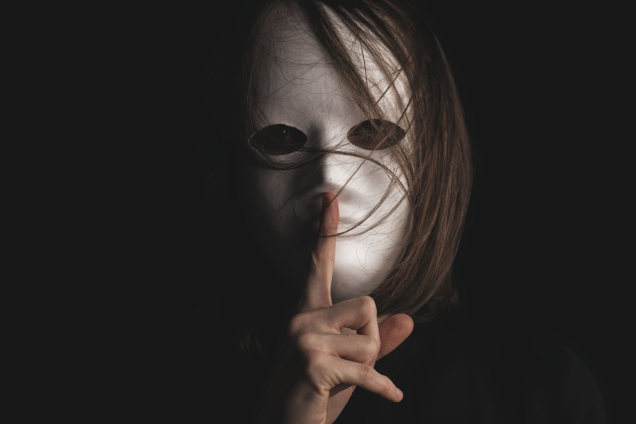 Mask, costume, woman-never trust a friend who is silent