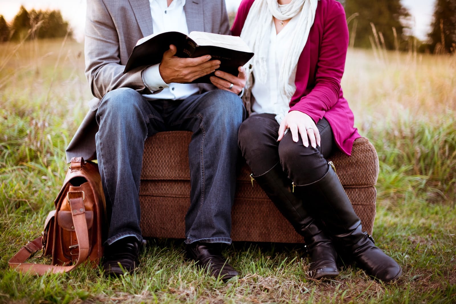 Two people sitting beside each other-couples reading together