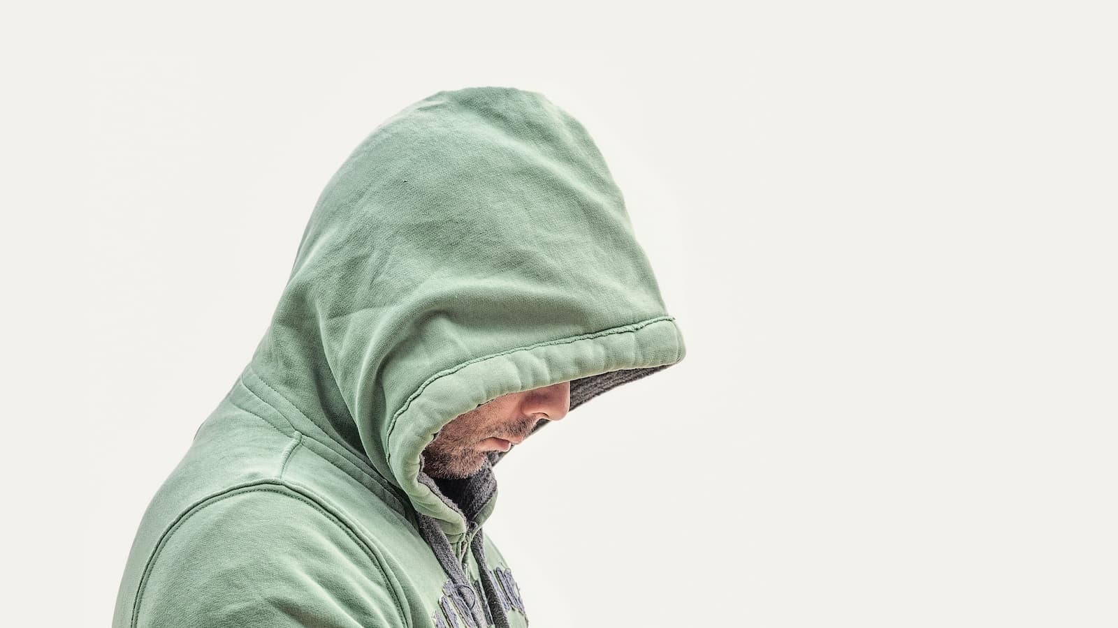 Man wearing green hooded jacket with white background-does it ever get better