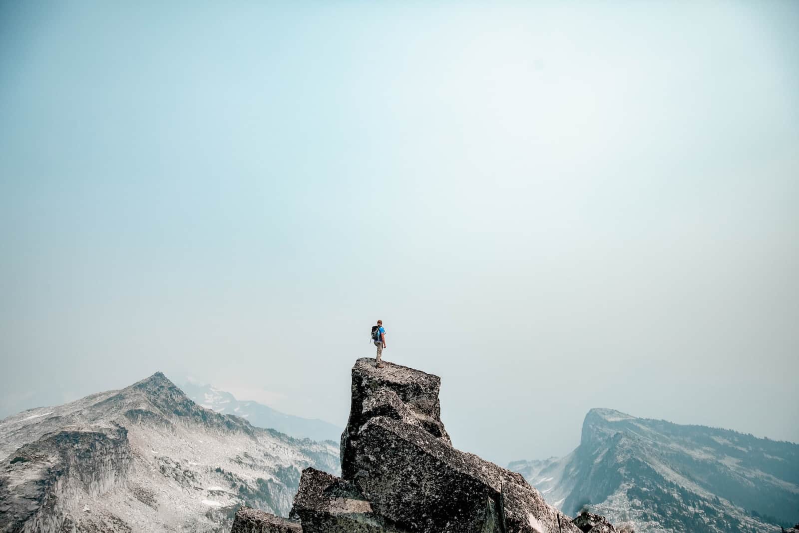 A person standing on top of a mountain
