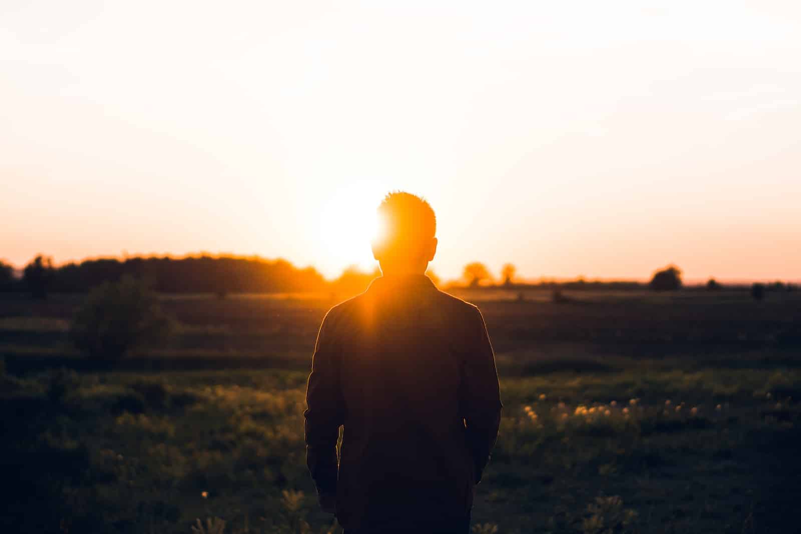 Silhouette of man facing sunset-how to get over yourself