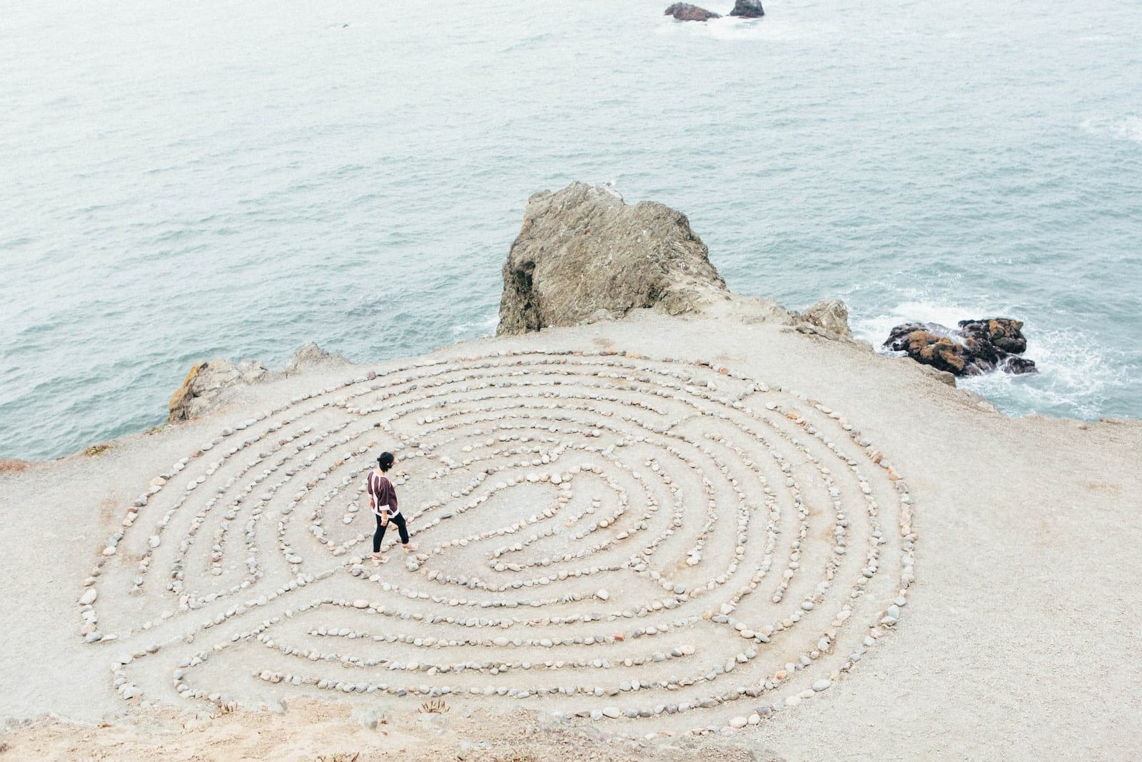 Person walking on beach during daytime-mental wellness