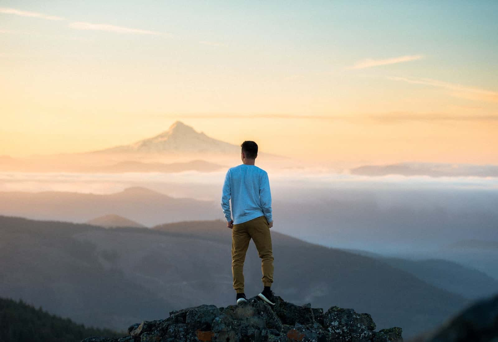Man standing on top of mountain-power of reflection