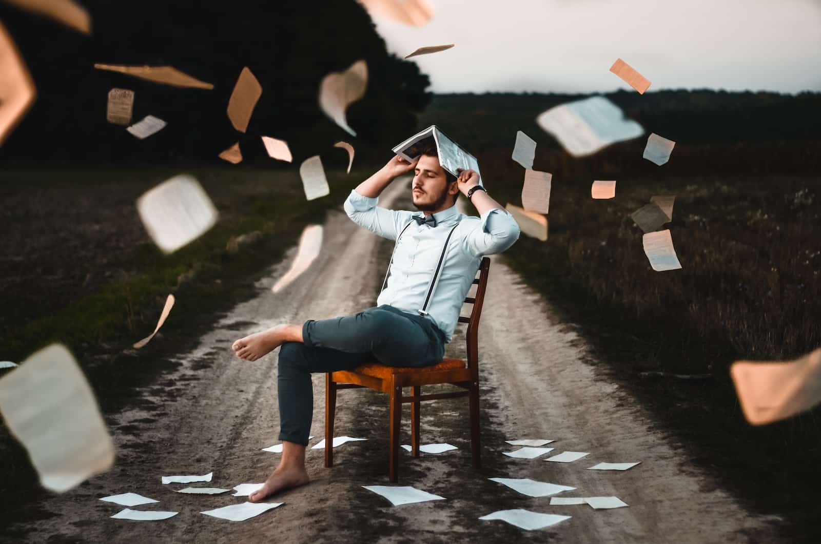 Man sitting on chair with book-setbacks to success