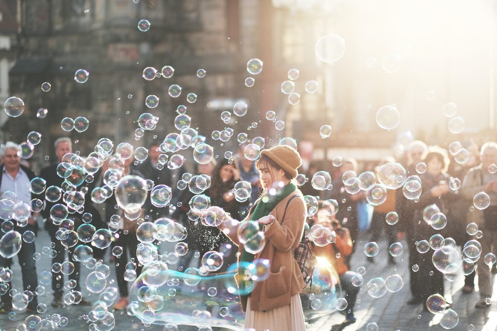 Woman standing outdoor surrounded by bobbles during daytime-spontaneous personality