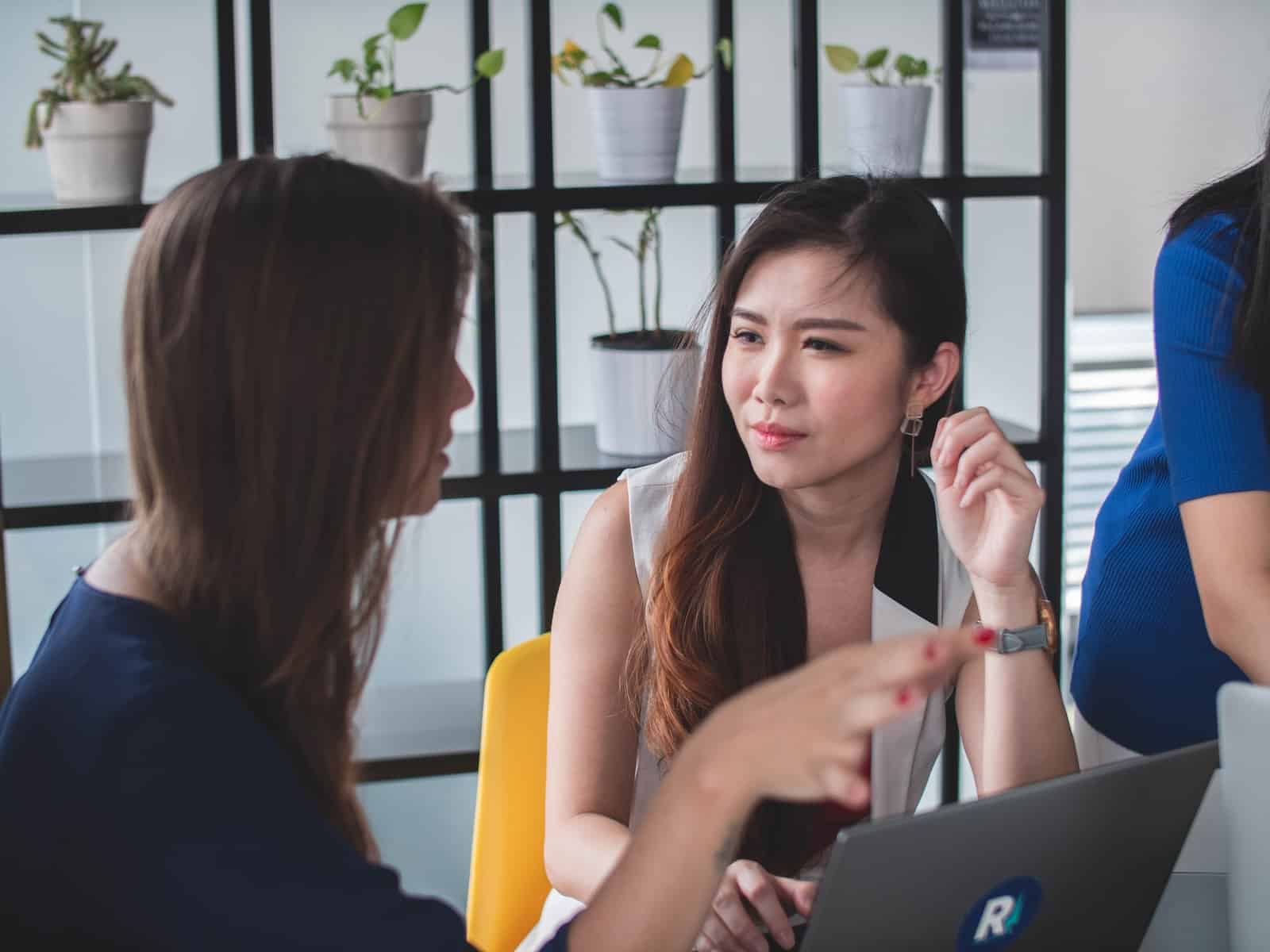 Woman sitting on yellow armless chair near gray laptop computer-listen to understand, not to respond
