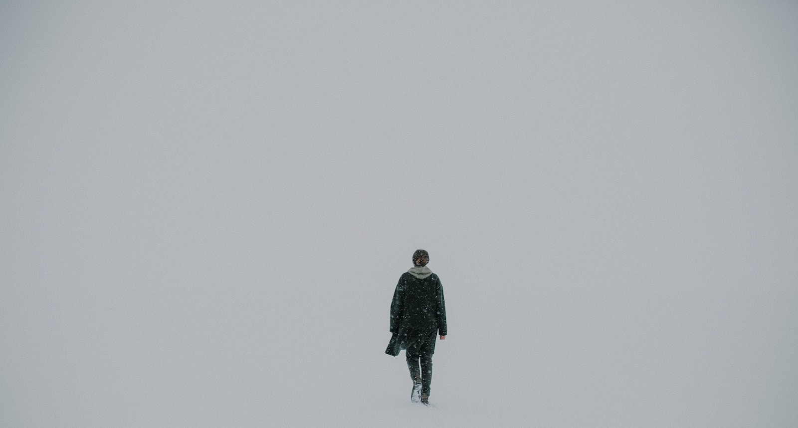 Man walking on white surface-feeling lost and alone