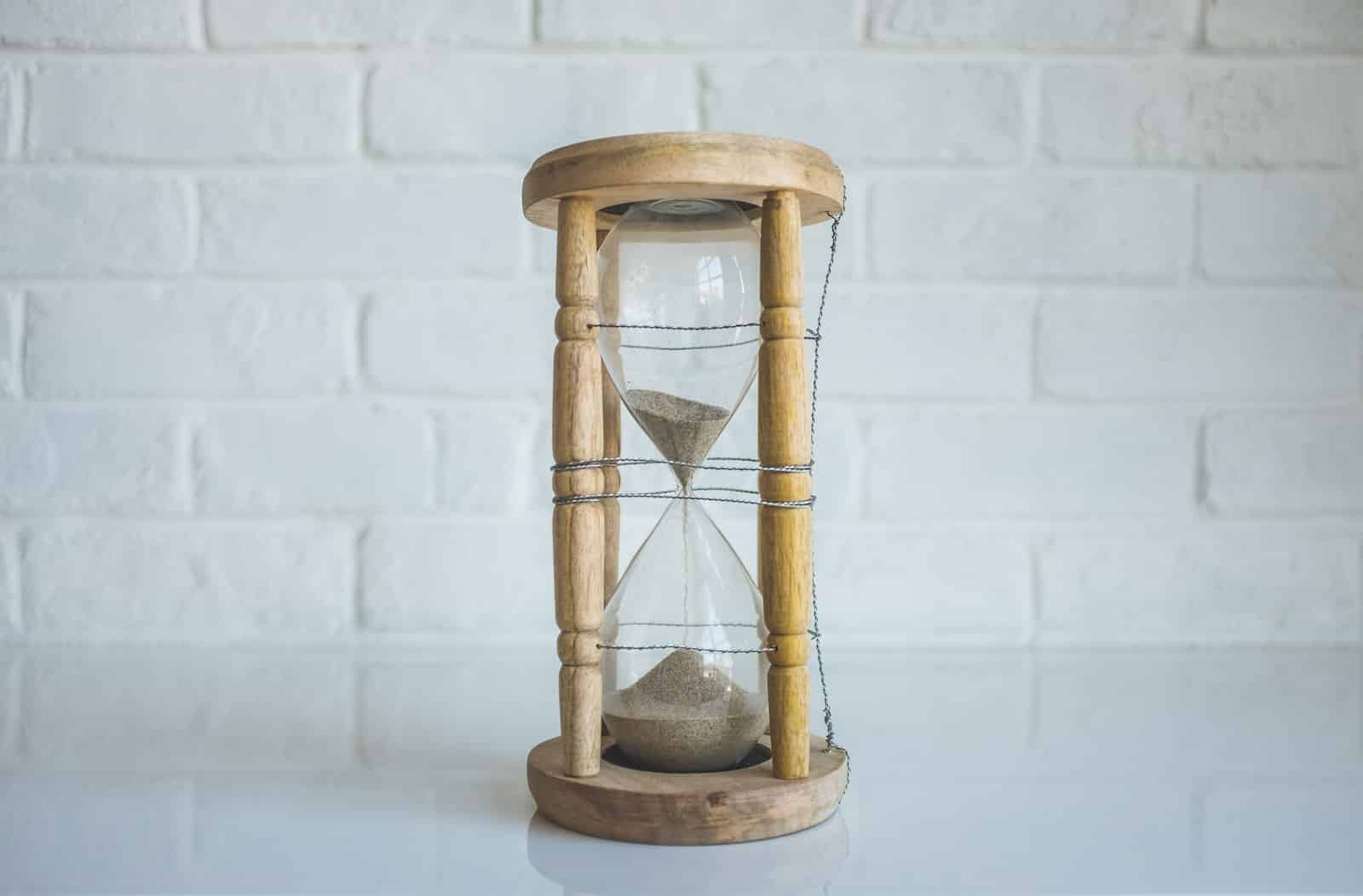 Clear hour glass with brown frame-art of taming time