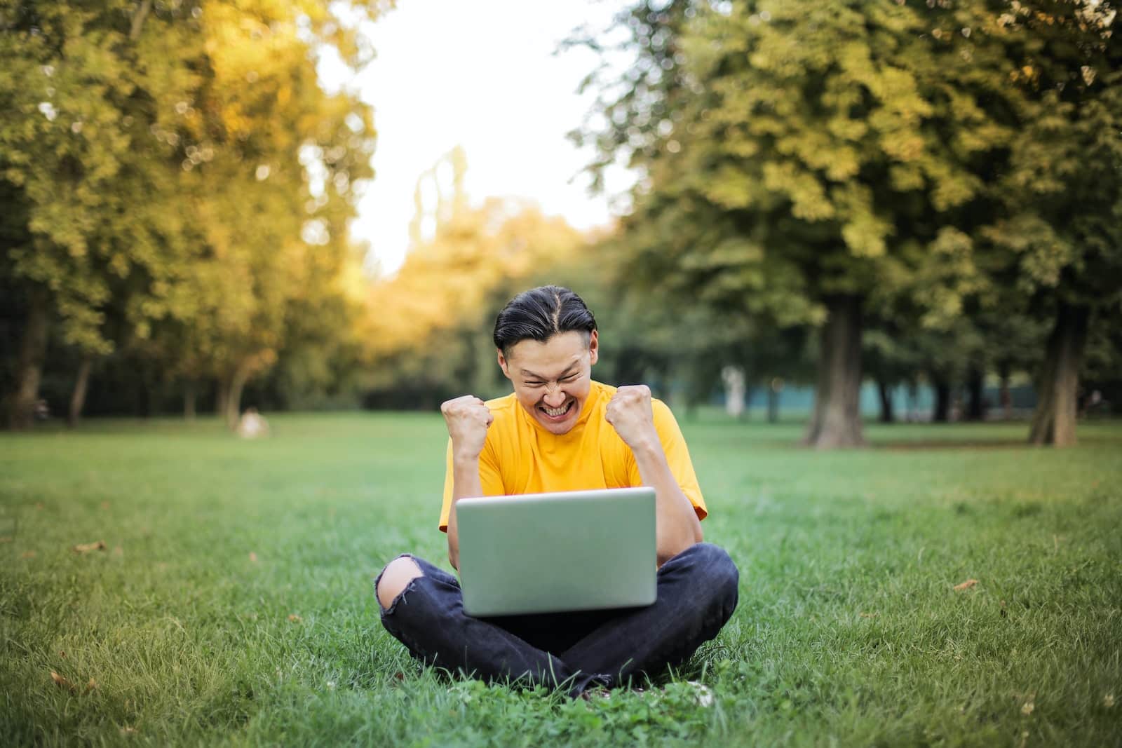 Man sitting on a green grass field-problem solving skills