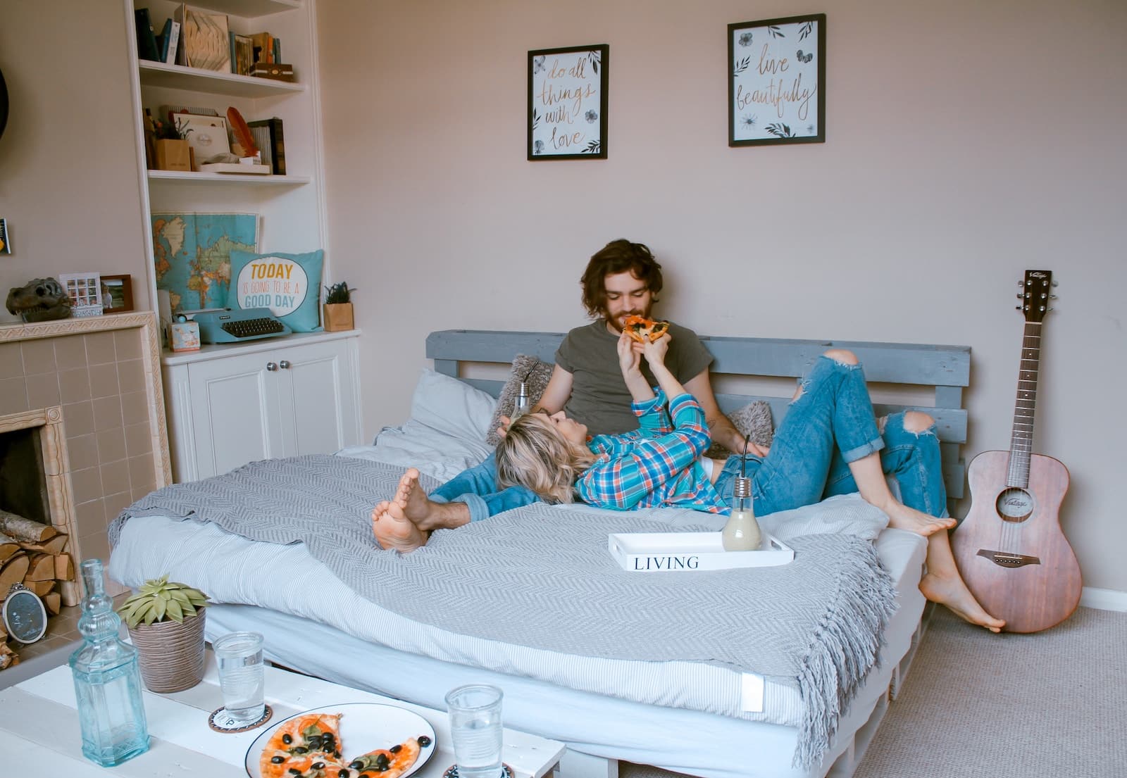 Man and woman lying on bed-living together before marriage