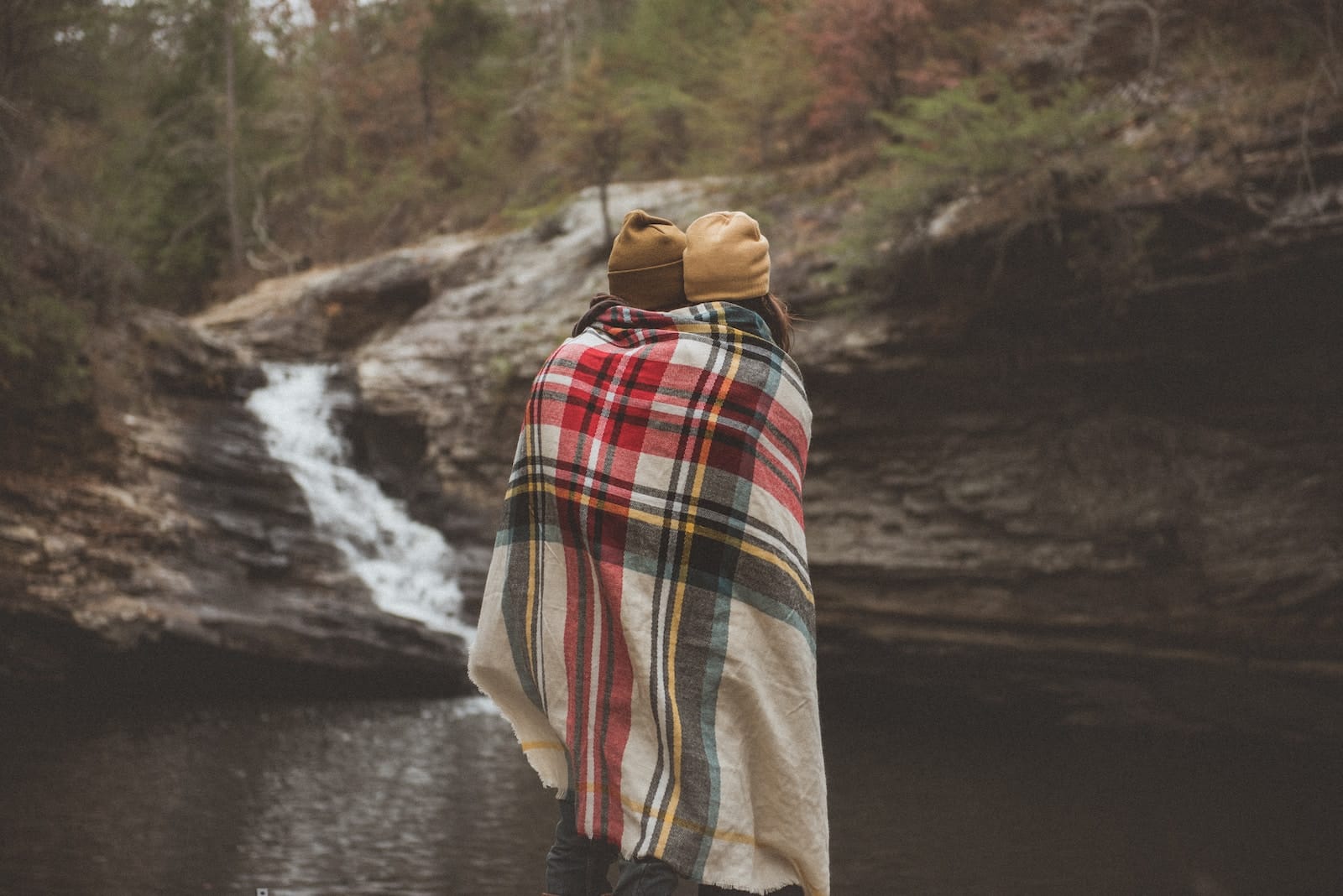 Two people standing beside each other near body of water-emotional baggage in relationship