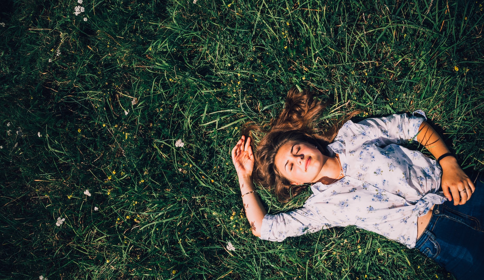 Woman lying on grass during daytime-afternoon slump
