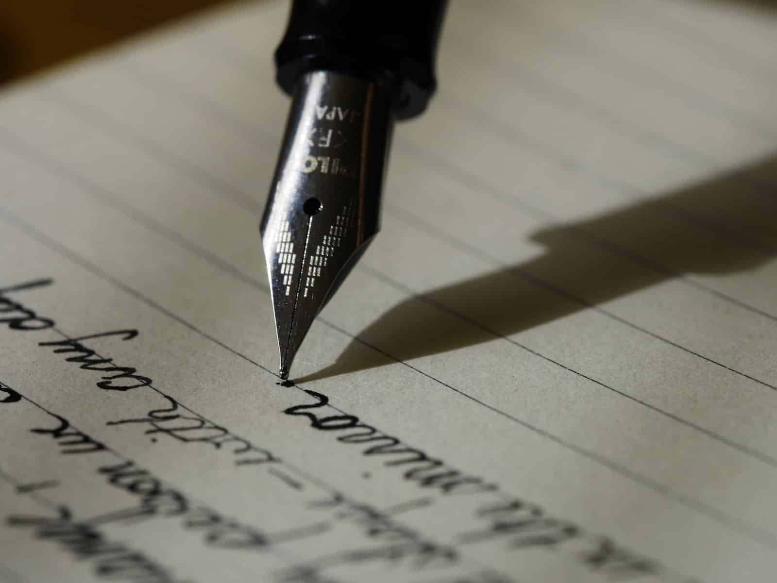 Fountain pen on black lined paper-why writing every day can change your life