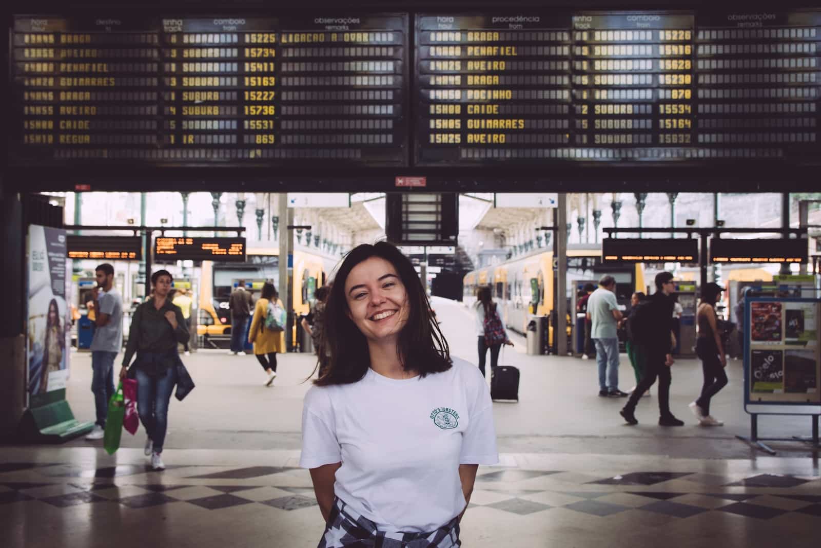 Woman in white crew neck t-shirt standing on white floor tiles-how expectation leads to disappointment