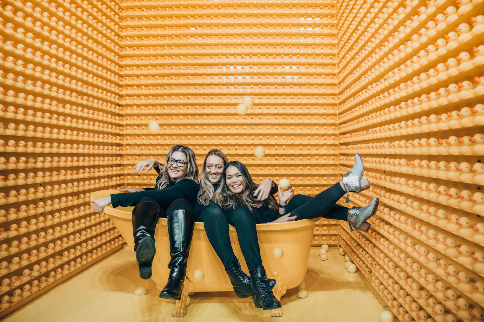 Three women sitting inside bathtub-are friends overrated