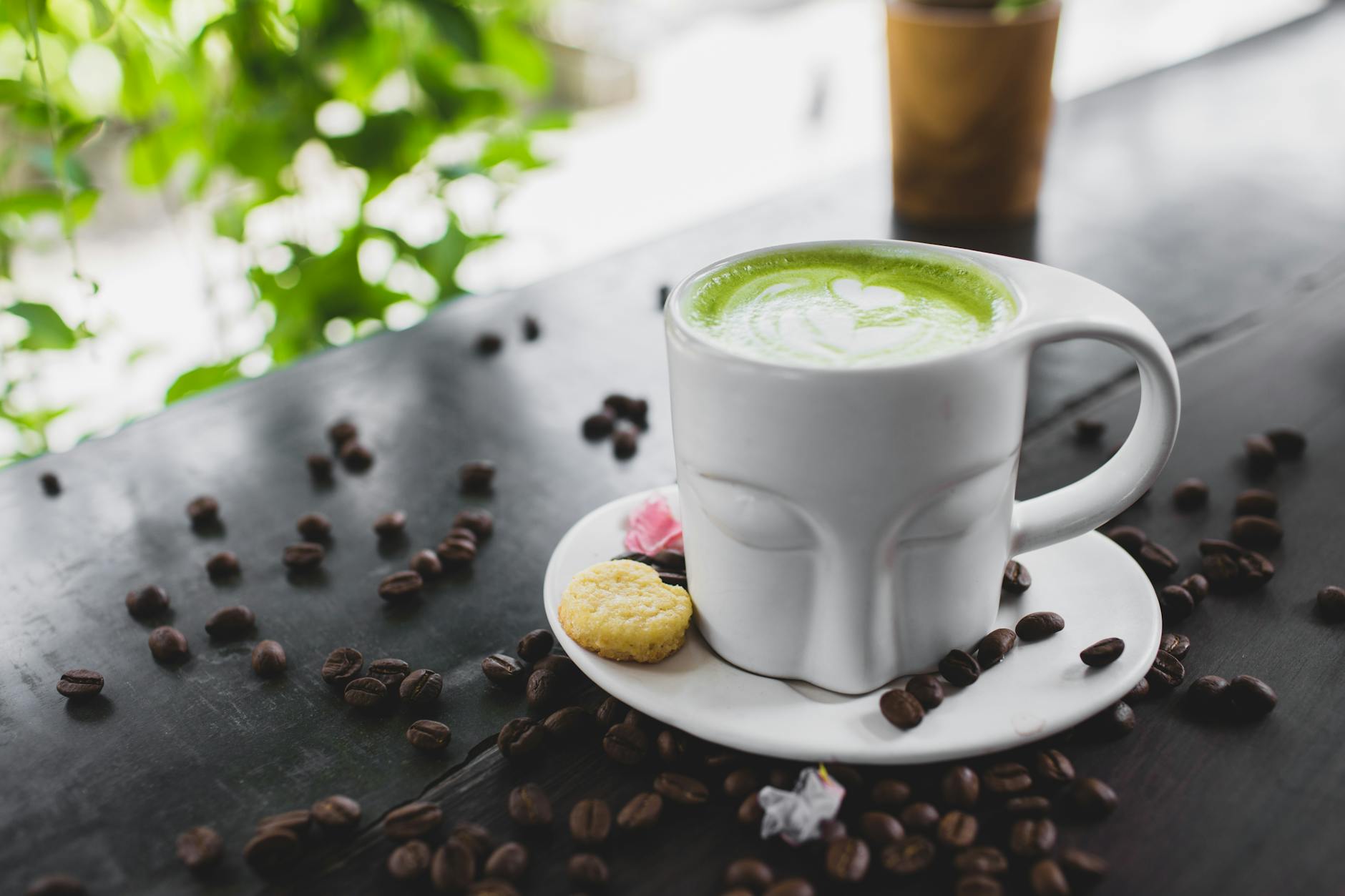 Close up photo of matcha latte on a ceramic cup-why does green tea make me nauseous