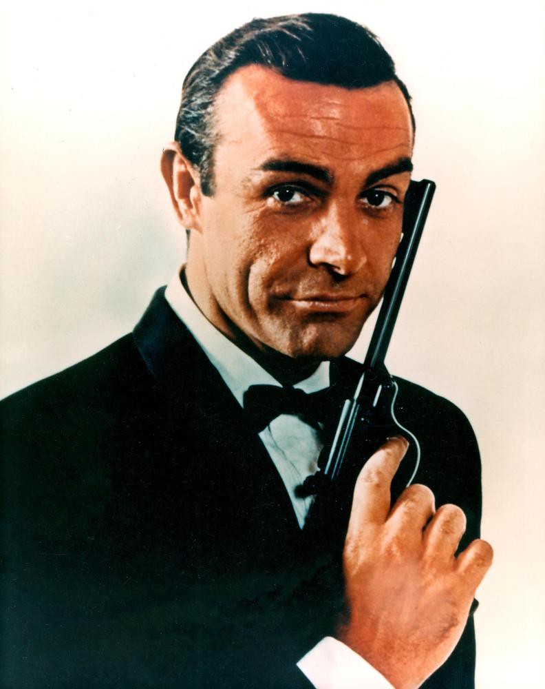 Sean Connery holding pistol as James Bond