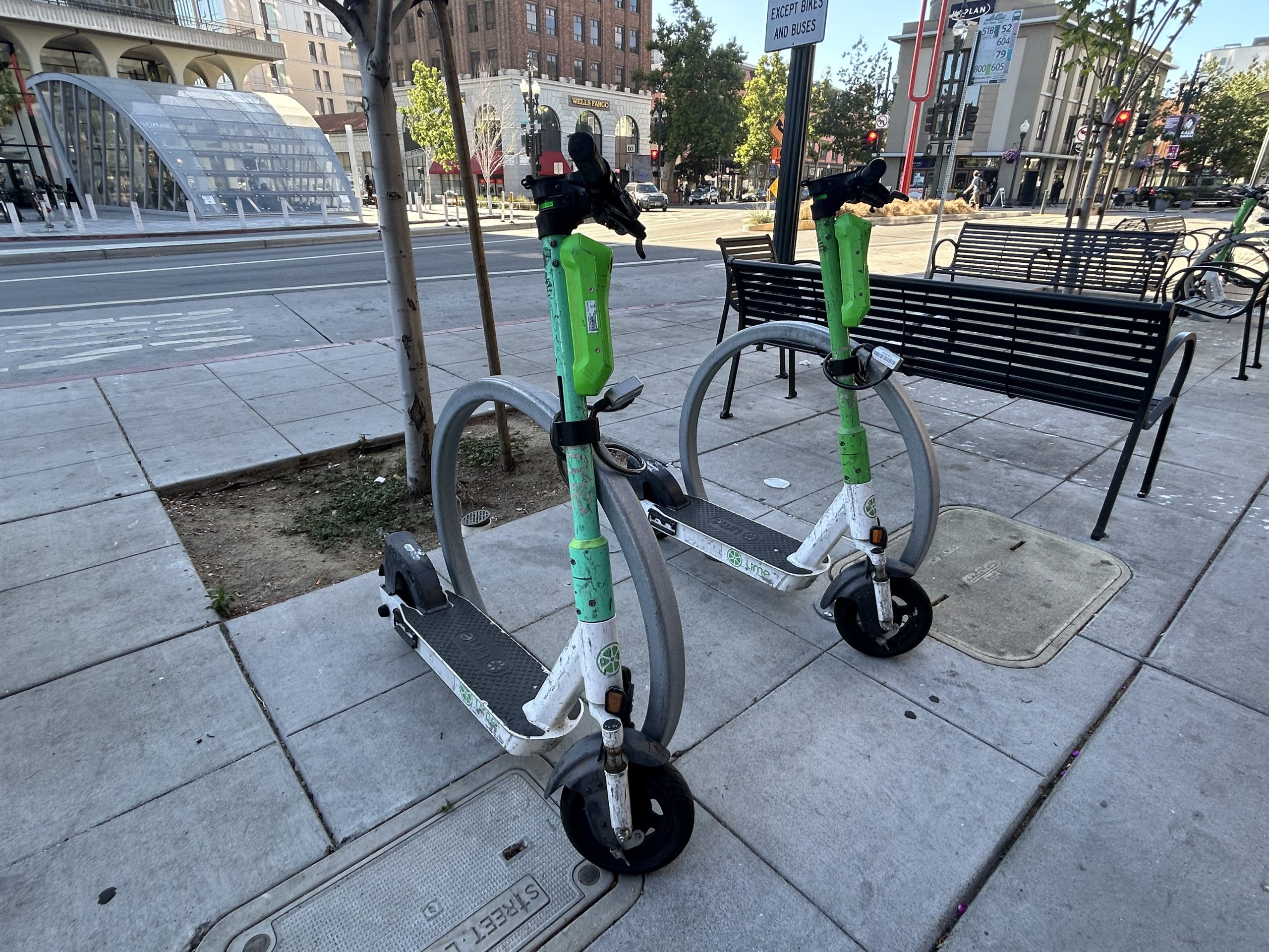 Several Lime e-scooters in downtown Berkeley