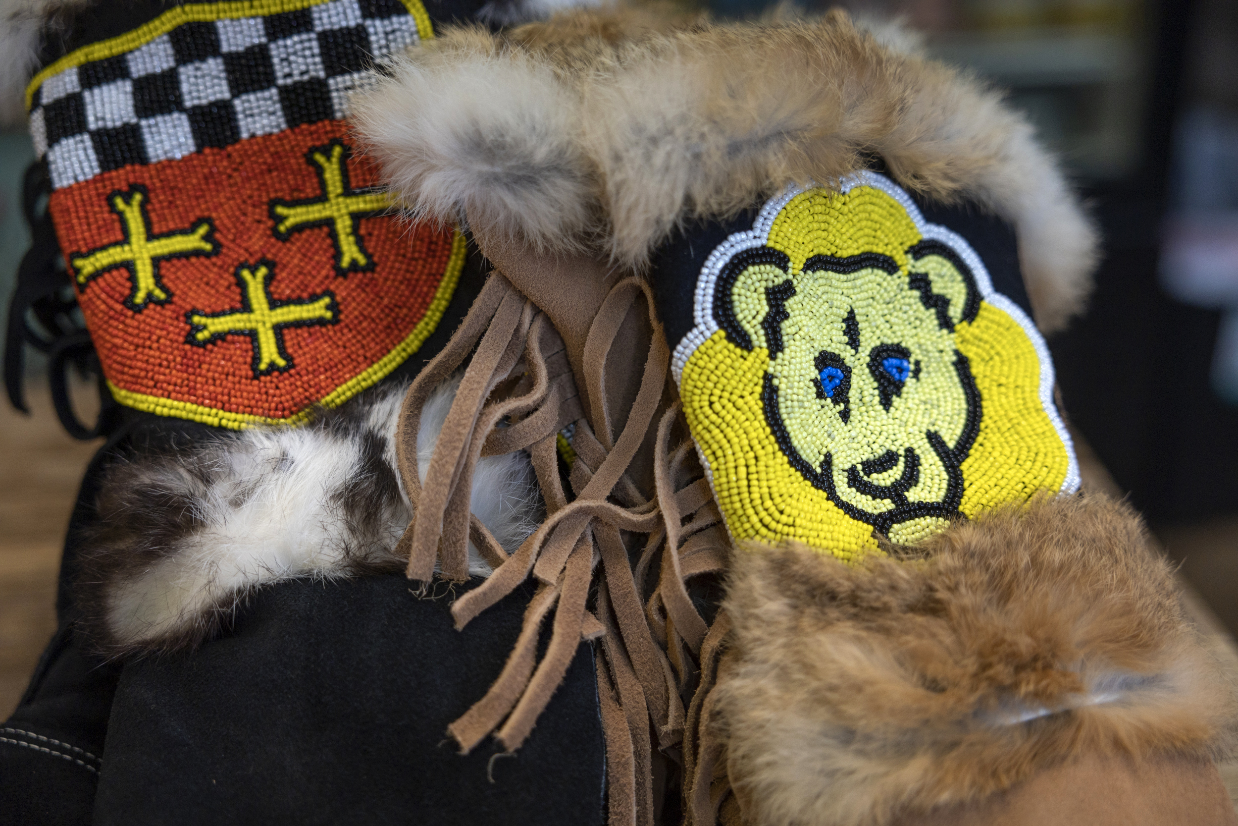 A close-up of the beadwork on a pair of mittens