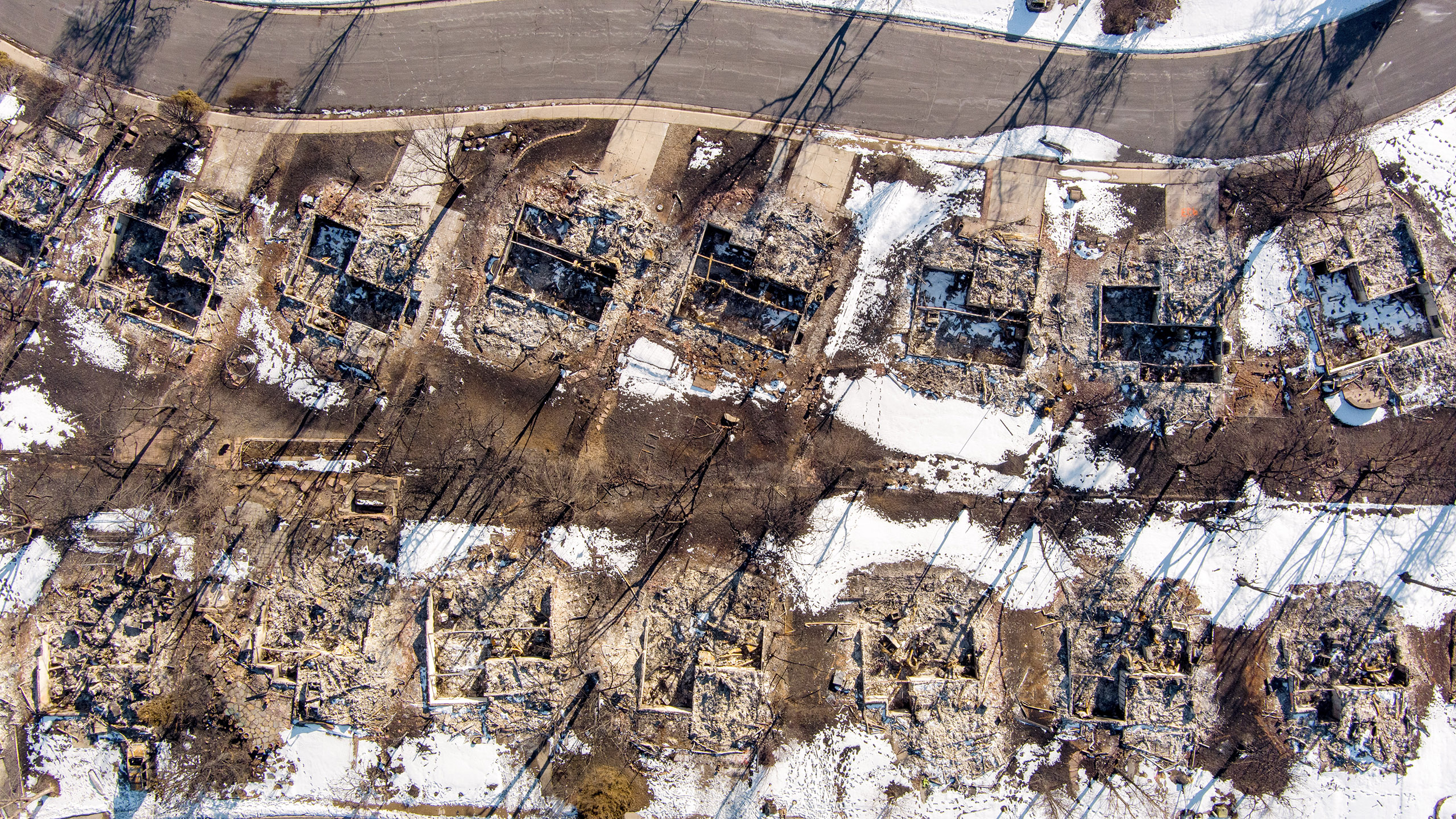 An aerial shot of burnt homes