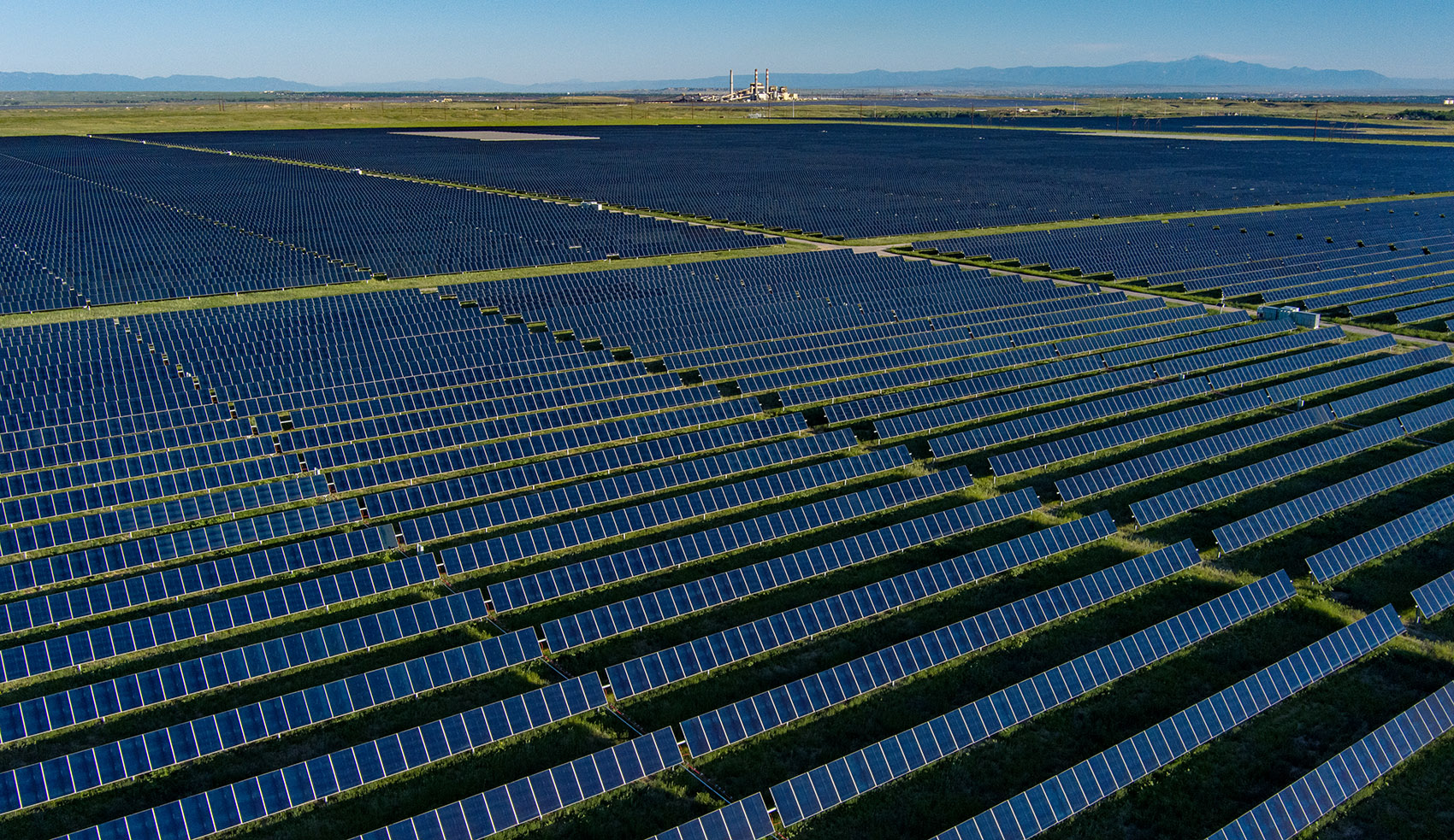 An aerial view of solar panels in a field.