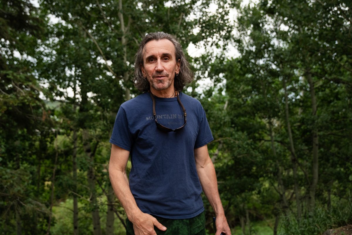 Billy Giblin poses for a photo outside while wearing a t-shirt.