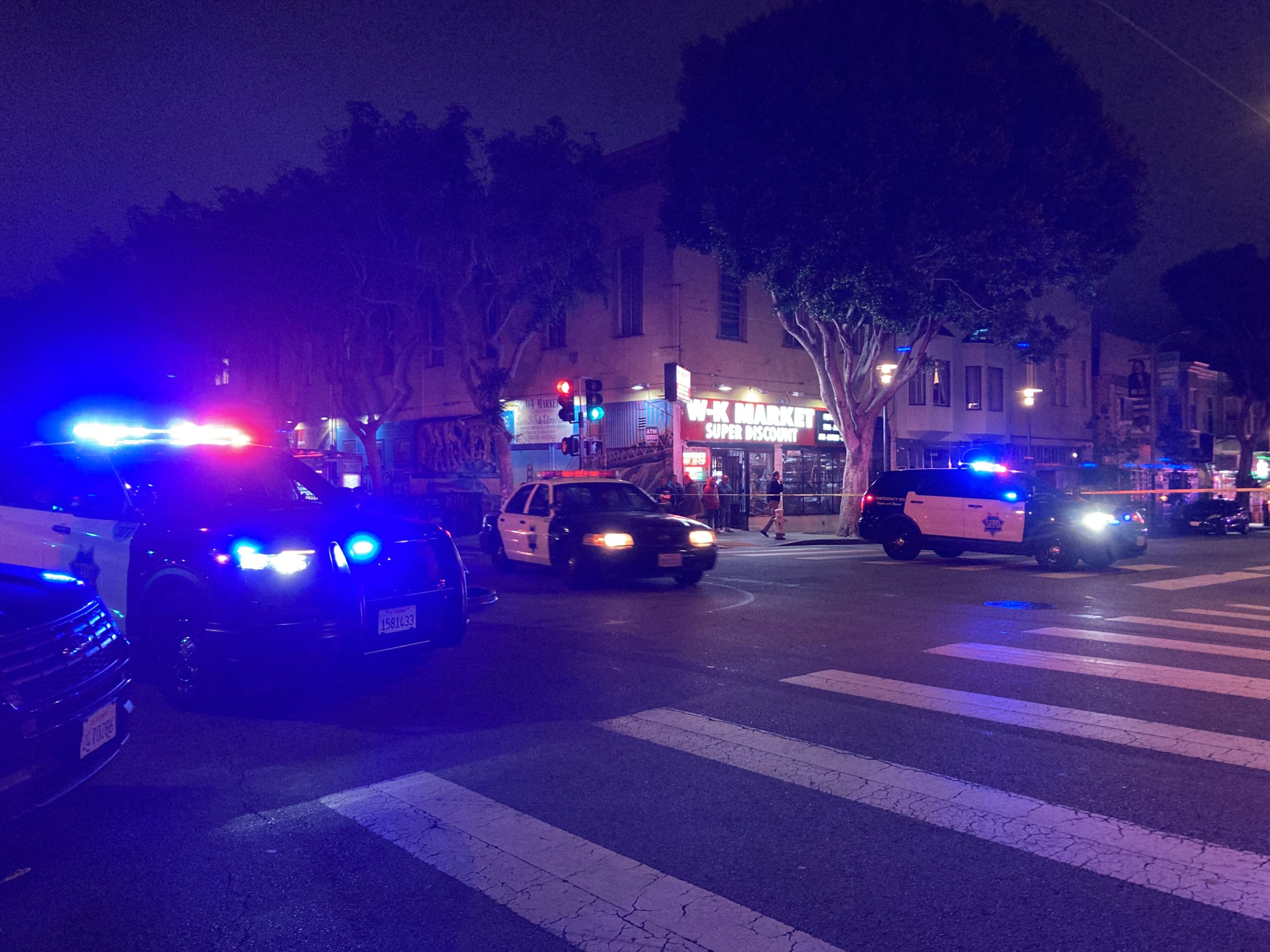 police cars gather at an intersection