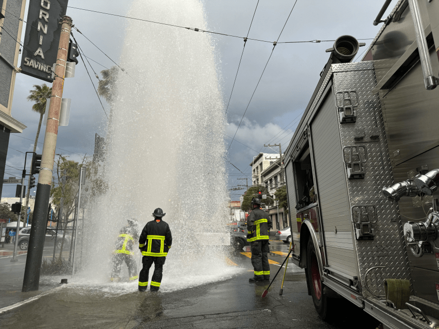 A fire hydrant gushing water into the air at 16th and Mission streets