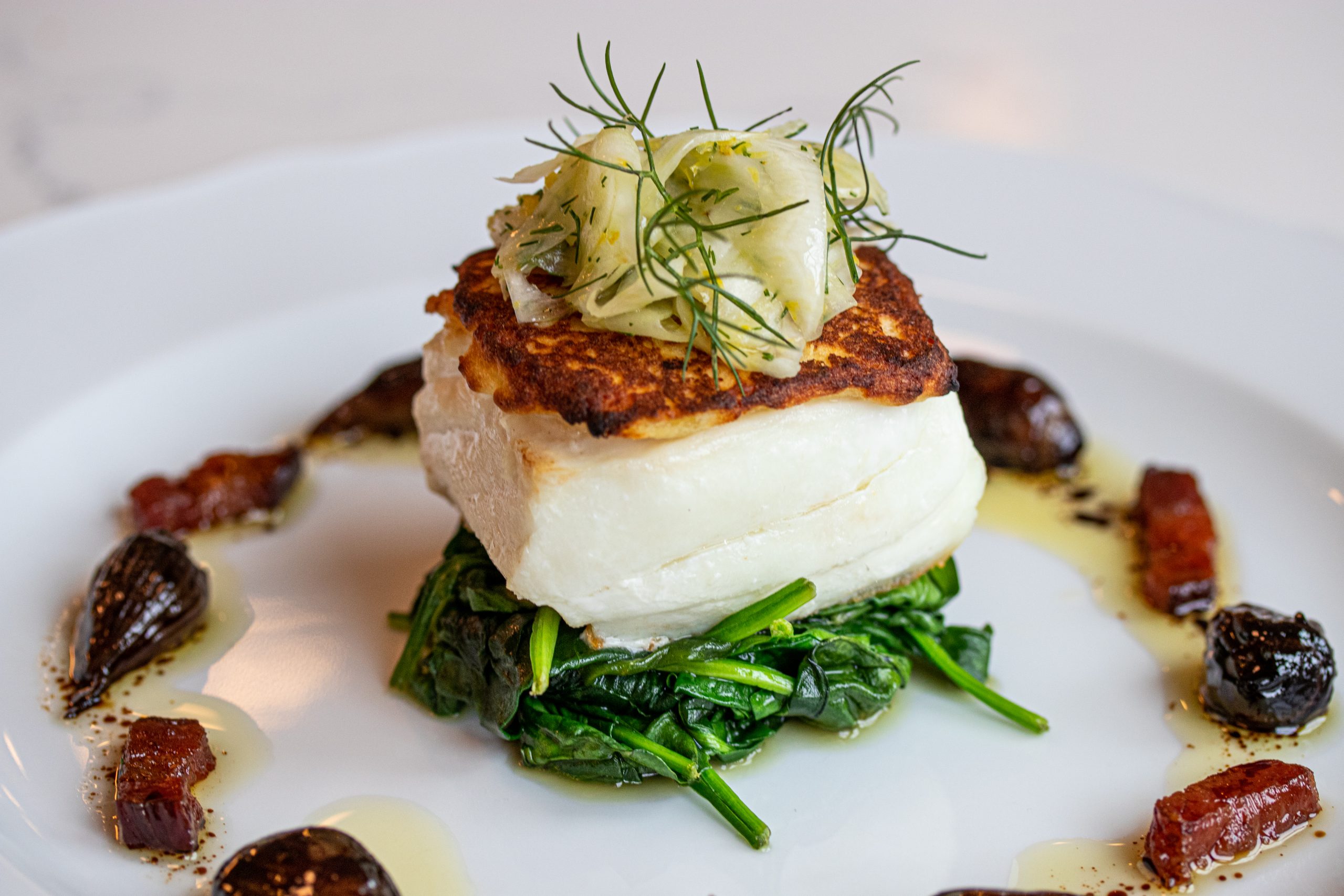 Poisson ‘À La John Haywood,’ a fish dish served at Petite Cerise in Washington D.C.