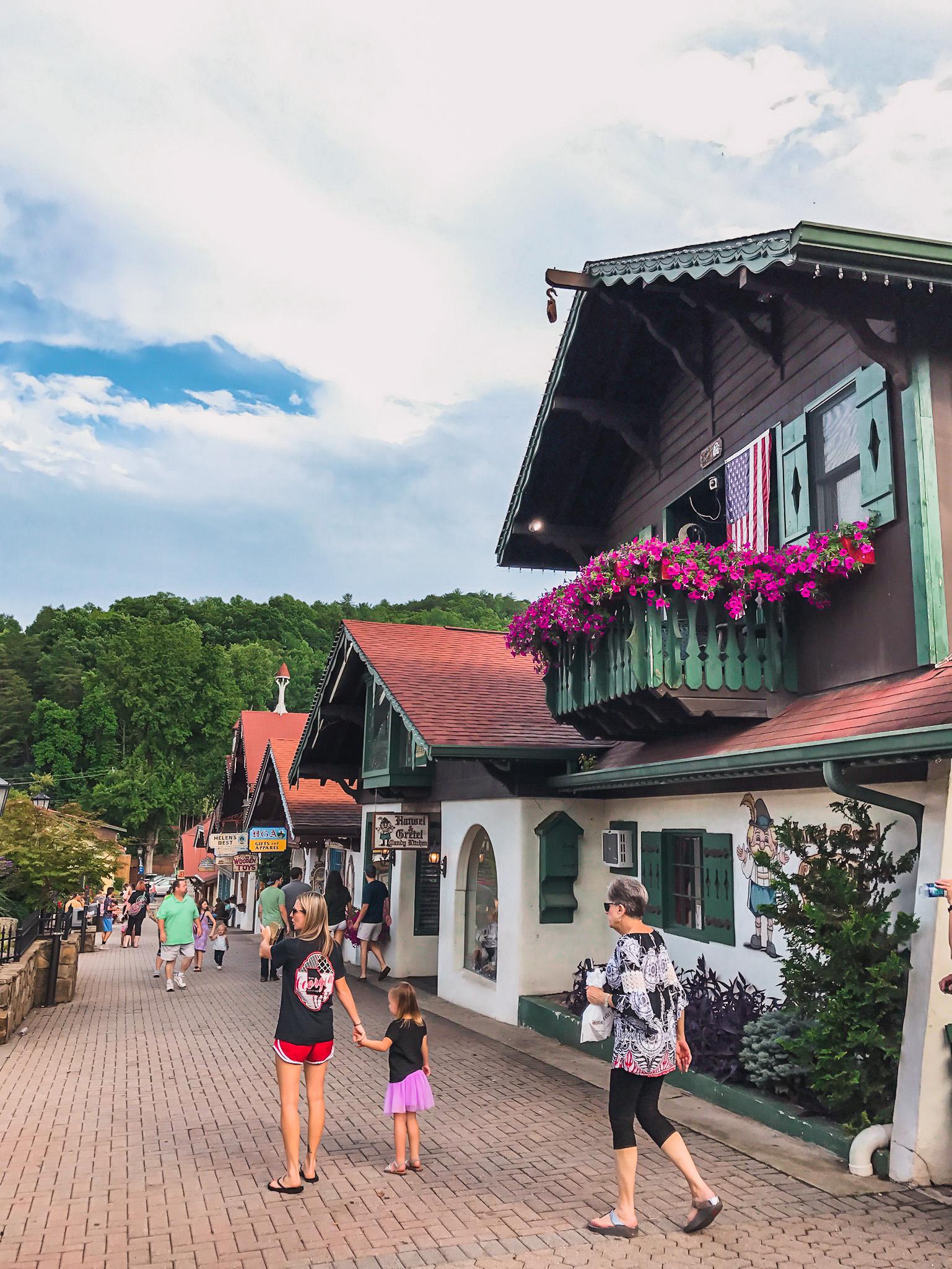 people walking down the street in the bavarian town in georgia