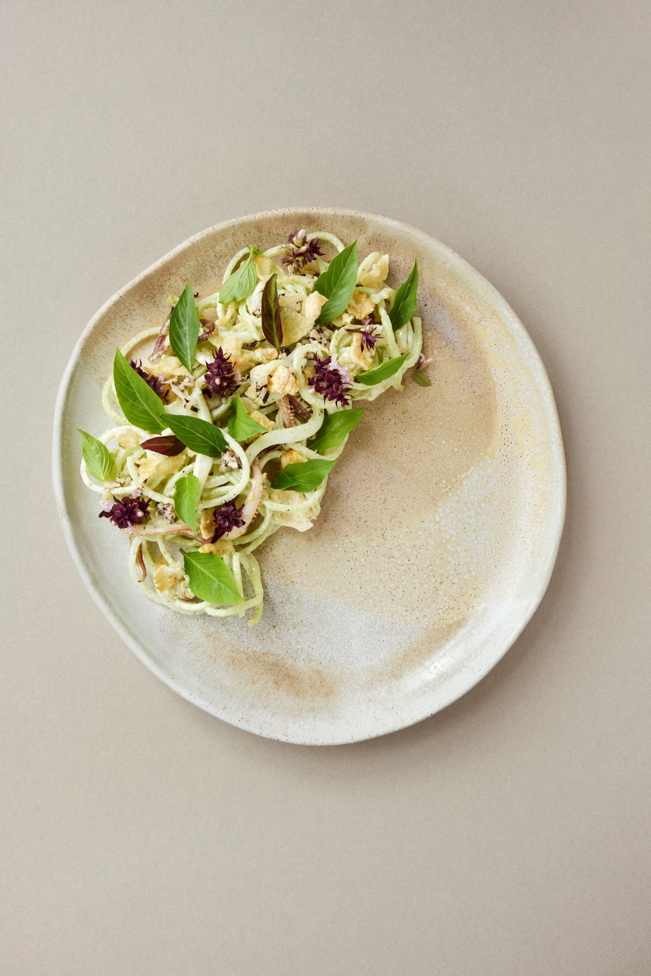Grilled Squid Salad, Shaved Vegetables, Charred Coconutnew eats in the new year 2024