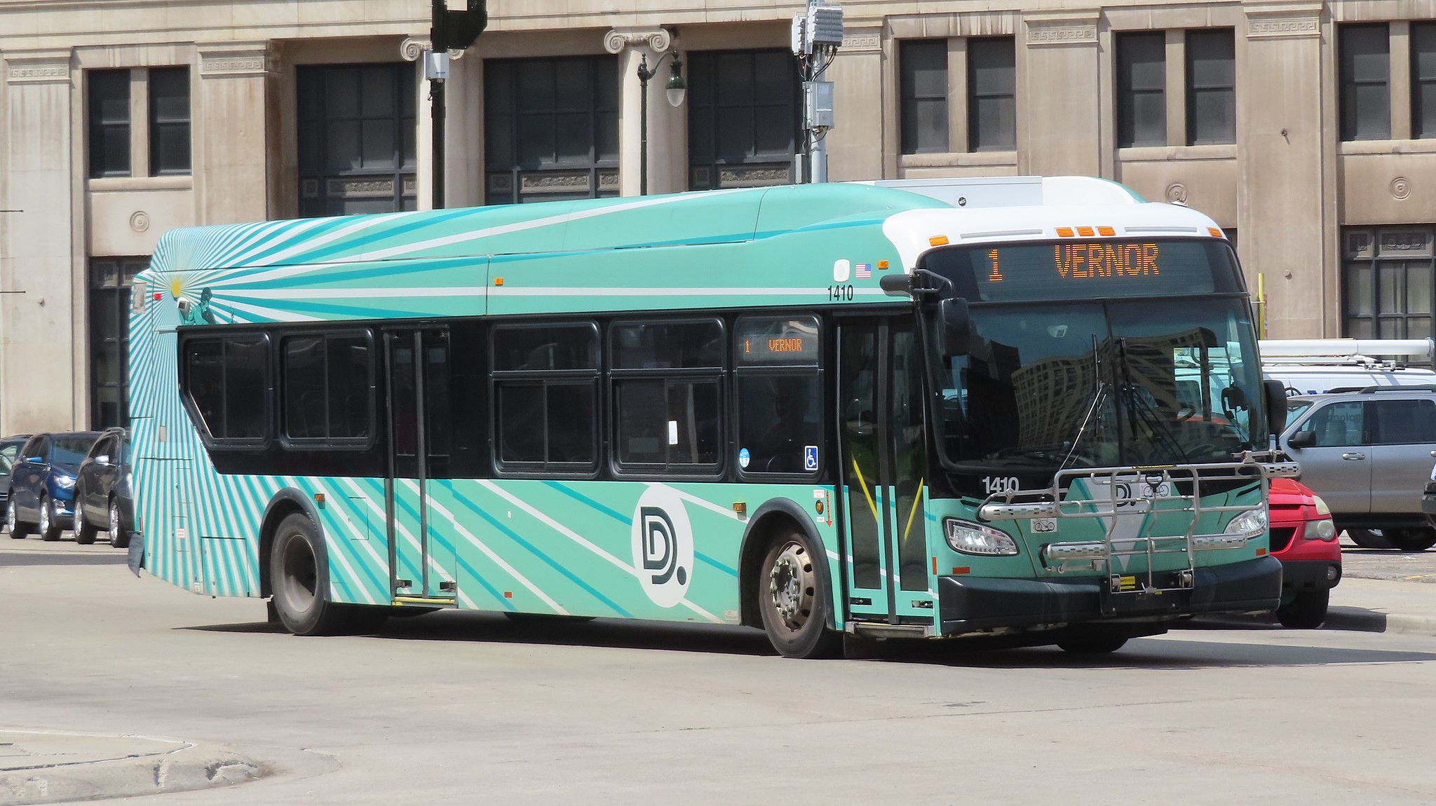 bus sitting on street in downtown detroit