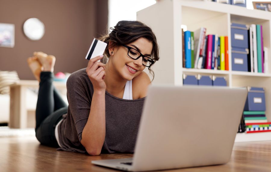 Happy woman doing online shopping at home