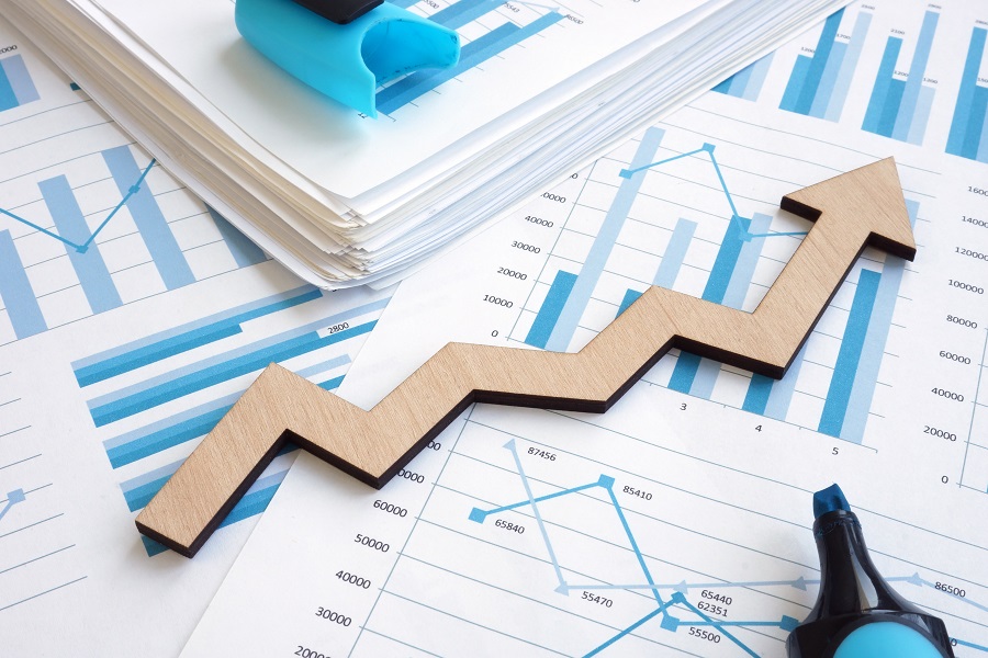 Business growth concept. Financial report with graphs and arrow.