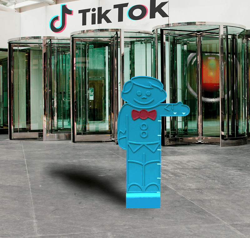 The exterior of a corporate office building, with the TikTok logo and wordmark over its revolving doors. From behind the revolving doors glares the hostile red eye of HAL9000 from Kubrick’s ‘2001: A Space Odyssey.” In front of the doors is a ‘you must be this tall to ride’ amusement-park cutout of a boy with a bow-tie, holding out his arm to indicate the minimum required height.